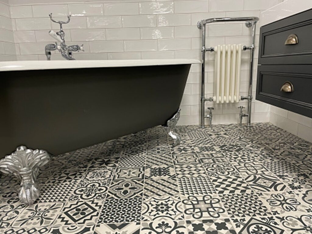 A bathroom with encaustic tiles